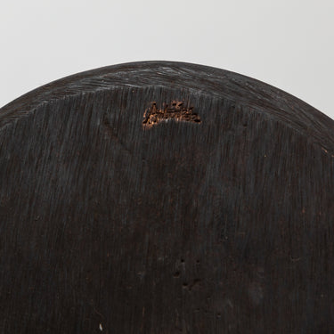 Close-up of a Aubock stamp on vase