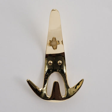 polished brass wall hook front view on a light gray background