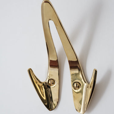 brass wall hook on a white background