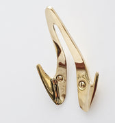 brass wall hook on a white background