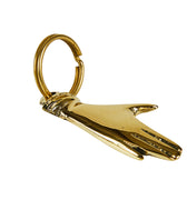 Gold hand keychain on a white background