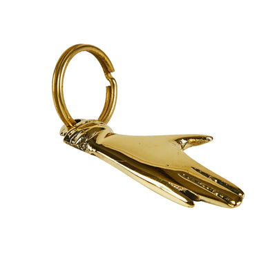 Gold hand keychain on a white background