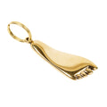 Gold foot-shaped pendant on a white background