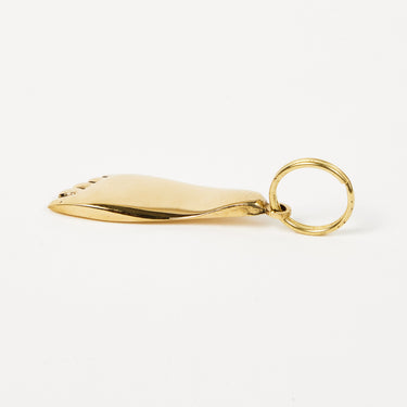 Gold pendant on a white background