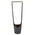 Tall, thin metal vase with a cylindrical base on a white background