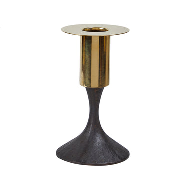 Two metallic candle holders with gold and black design on a white background