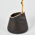 Black vase with gold rim on a white background