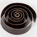 Black spiral pen holder desktop decor on a white background