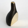 Black and gold vase on a white background