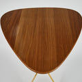Triangular wooden table with a white background