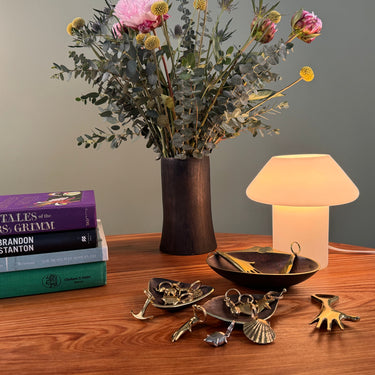 flowers and keyrings with a glowing glass vintage lamp