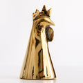 Gold rooster-shaped object with a crown on a white background