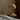 Beige table lamp on a wooden side table against a beige wall scandinavian neutral bedroom inspo.
