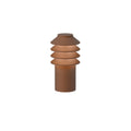 Cylindrical corten red pathway light with layered shade on a white background
