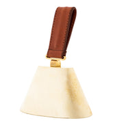 decorate and functional Brass cowbell with a brown leather handle on a white background