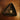 Triangular dark brown dish with a gold star-shaped pendant on a wooden surface