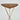 Wooden table with gold metal legs on a light gray background