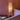 Dorica floor lamp against pink wall