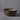earthgender sunburst etching detail ceramic planter cressey maxwell on grey background