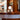 Wooden bar counter with decorative tile edge and smoke glass gelato lamp carlo nason