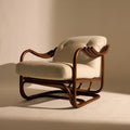 Vintage-style armchair with wooden frame and white cushion on a beige background