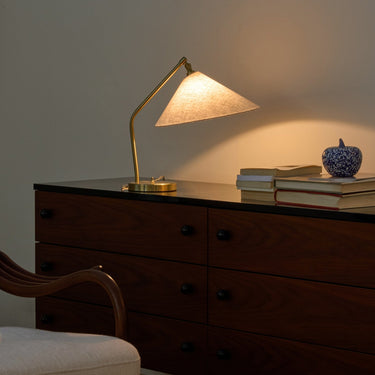 Gräshoppa Table Lamp in Brass with Canvas Shade by Greta M. Grossman for GUBI Two Enlighten lit bookcase lifestyle