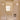 Bathroom with offwhite heath tiles, a gio ponti gubi mirror, and bathroom products.