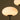 Close-up of a floor lamp with a white glass shade against a dark background