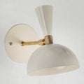 Wall-mounted ivory white light fixture with beige and gold design on a light gray background for Two Enlighten