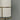White lampshade with gold metal stand against a gray background
