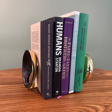 melies aubock bookends on wood table with books