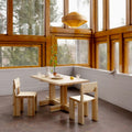Wooden dining set with table and chairs in a room with large windows Hans-Agne Jakobsson '1003 Hans Pendant' in Pine for Two Enlighten