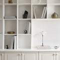 PH 2/1 portable chrome table lamp louis poulsen poul henningsen two enlighten bookshelf lifestyle