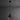Black pendant light with copper interior on a dark gray background