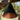 Black and copper pendant lamp hanging from a tree