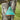 Turquoise patina outdoor pendant light hanging from a tree branch