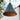 Conical metal lamp with greenish-blue patina hanging outdoors.