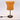 Table lamp with orange shade and black base on a white background