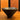 A dark brass matte-finished conical bowl or cup with a metallic rim, sitting on a wooden surface against a wooden slat background.
