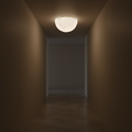 Light fixture on a ceiling in a dimly lit hallway