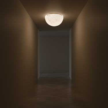 Light fixture on a ceiling in a dimly lit hallway