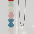 Colorful rug color study with stacked circular shades on a white background