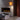 Modern living room with a fireplace and standing lamp.