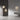 Modern pendant lights hanging in a minimalistic room with a neutral color palette.