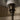 Close-up of a lampshade and fixture on a neutral background