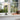 Table lamp on a windowsill with a view of trees outside