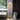 PH 3½-2½' floor lamp in a living room setting with a window and curtain.