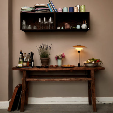 yellow metal lamp on rustic table bar table