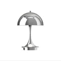 Silver dome-shaped chrome finish small table lamp on a white background