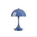 Blue panthella portable table lamp on a white background